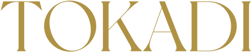 ©Tokadi. Golden TOKADI text logo on a transparent background.